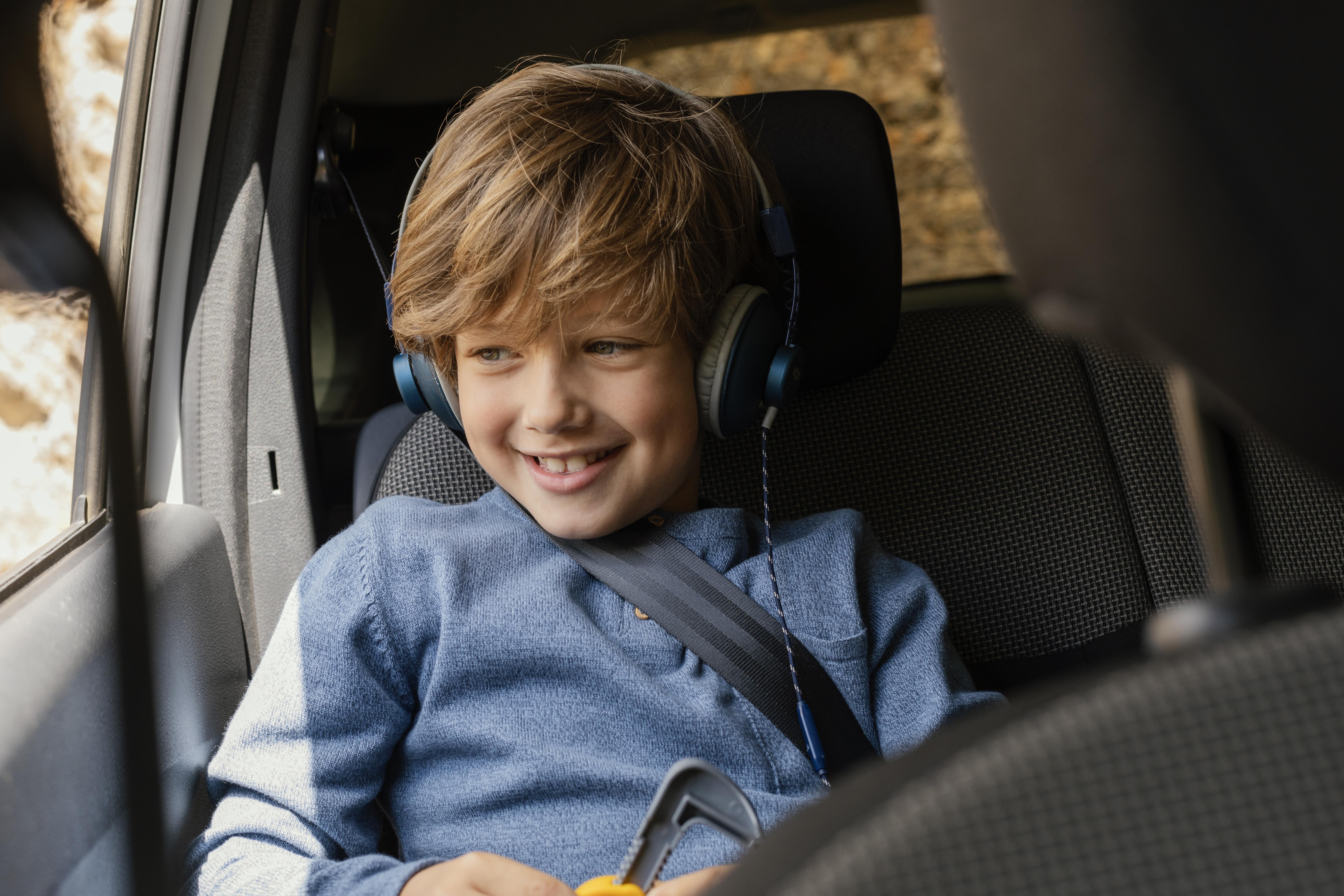 portrait-young-boy-car